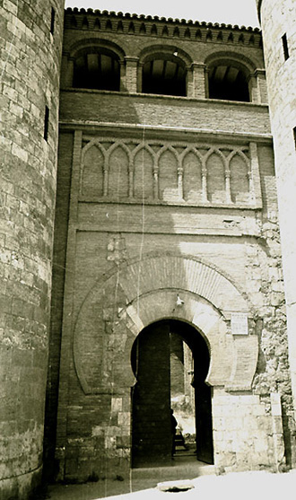 The entrance to the Jafiriyya Palace in Saragossa, 11th century, seems to have been strongly influenced by the entrance at the Great Mosque of Cordoba in the photograph to the left.